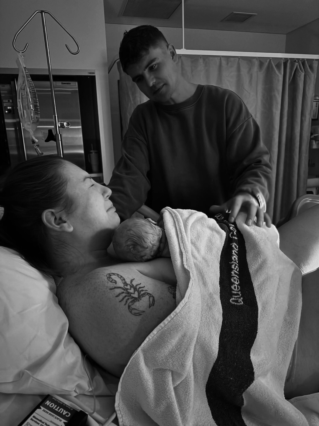 Tia holding newborn Hudson on her chest