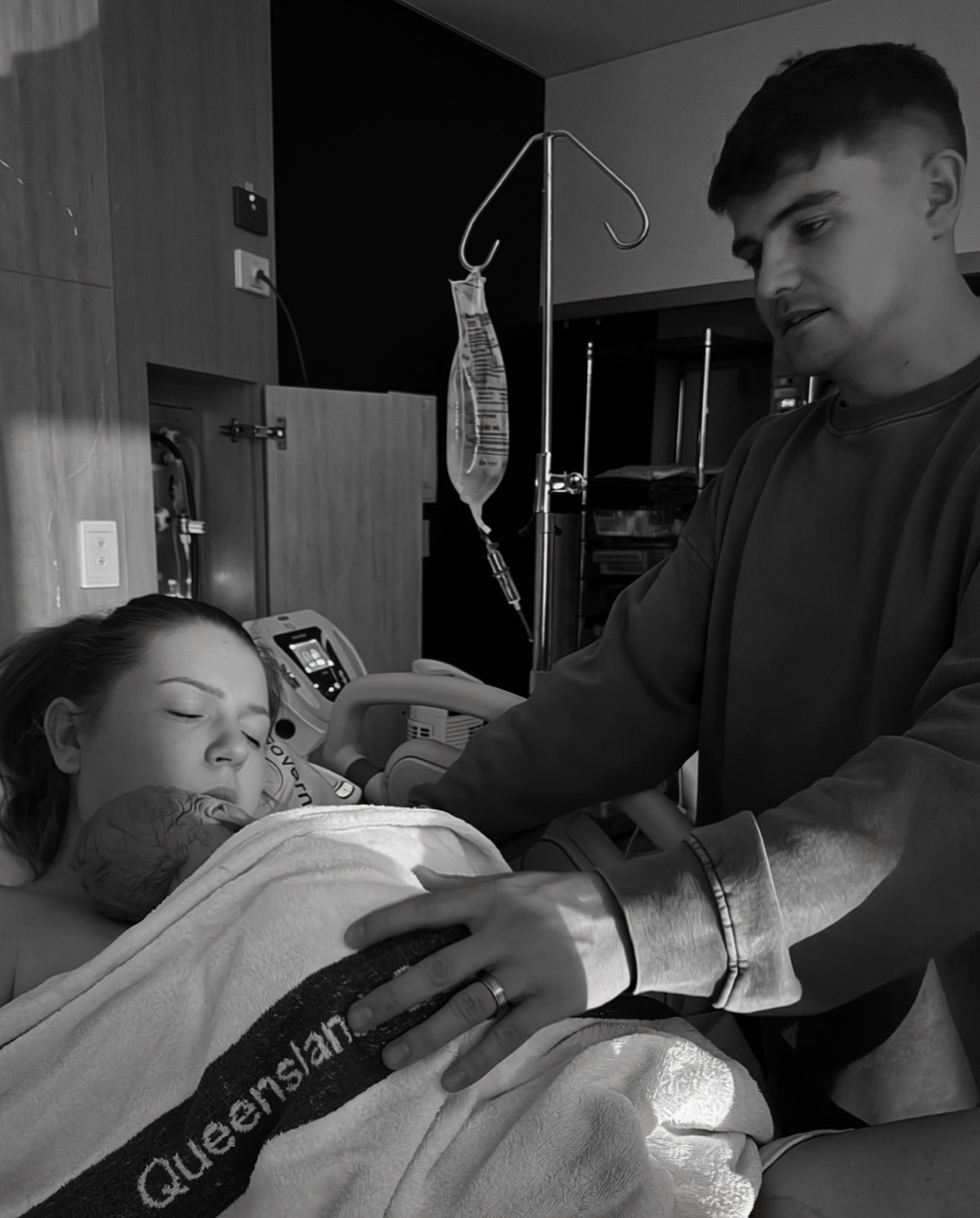 Tia and her husband with newborn Hudson
