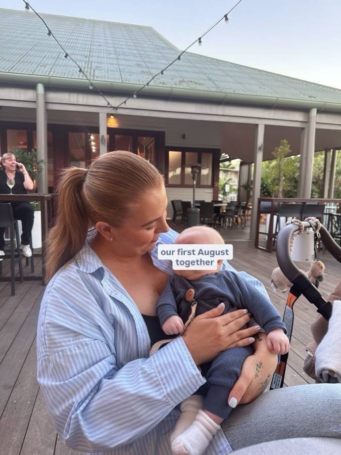 Holding Hudson on a night out, our first August together